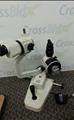 Lot: 14-7-79: (1) Topcon SL-2E (1) Haag-Streit Bern H 04 