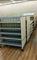 Lot: 14-2-7729: (2) 4 Tier Garment Display  Table(s) (11) Gondola "H" Rack(s) 48"  