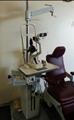 Lot: 15-7-7707: (1) Woodlyn Opthamlic Chair (1) Woodlyn Optical Stand 
