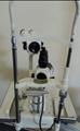 Lot: 15-7-7707: (1) Woodlyn Opthamlic Chair (1) Woodlyn Optical Stand 