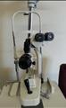 Lot: 15-7-7707: (1) Woodlyn Opthamlic Chair (1) Woodlyn Optical Stand 