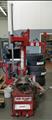 Lot: 15-3-9695: (1) Coats 7060AX Rim clamp tire changer (1) Coats 5060AX Rim clamp tire changer 