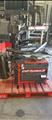 Lot: 15-3-10661: (1) John Bean EHP System II - Tire changer (1) Coats 5060AX Rim clamp tire changer 