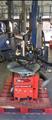Lot: 15-3-10661: (1) John Bean EHP System II - Tire changer (1) Coats 5060AX Rim clamp tire changer 