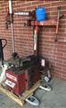Lot: 15-3-10784: (1) Coats 7060AX Rim clamp tire changer (1) Coats 5060AX Rim clamp tire changer 