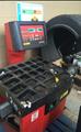 Lot: 15-3-11385: (1) Corghi A9824 TI Rim Clamp Tire Changer (1) Corghi EM 8540 Computerized wheel balancer 